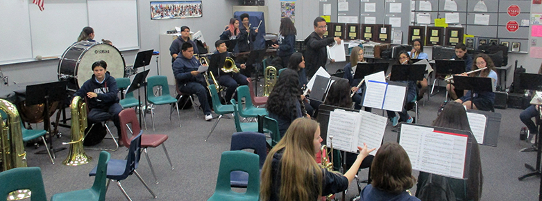 Students in a music class play their instruments